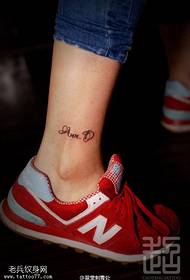 English signature tattoo on the ankle