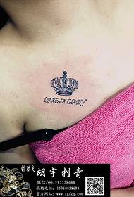 Woman chest crown tattoo