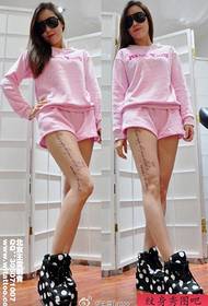 Beautiful female flower tattoos on the legs of girls