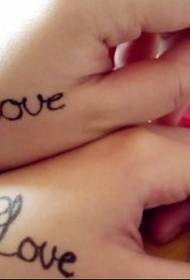 Girls hand back LOVE English tattoo pictures