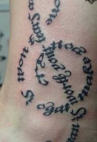 kājas ārpuses vēstules piezīmes tetovējums