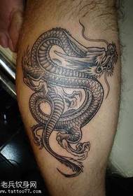 drago nero grigio gamba modello di tatuaggio