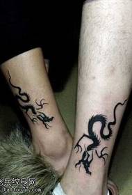 Patrón de tatuaxe de par de tótem de dragón de pernas