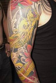 braccio tatuaggio drago loto