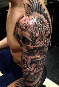 braccio tatuaggio ali teschio