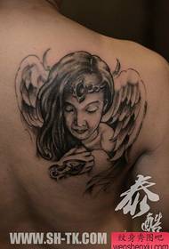 spalle del ragazzo bellissimo e bellissimo modello di tatuaggio angelo