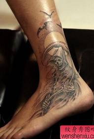 a cool death tattoo tattoo on the foot