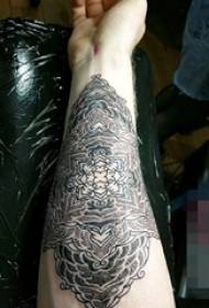 Boys arm on black gray point sting technique abstract line mandala tattoo picture