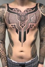 traditional totem combined with geometric patterns tattoo works