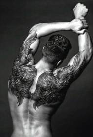 Dos et bras étonnant modèle de tatouage réaliste gris ailes noires