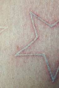 white little star tattoo picture