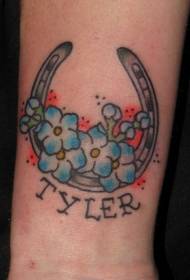 Підкова з малюнком синій квітка татуювання