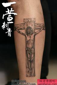 'n beenkruis Jesus-tatoeëringspatroon