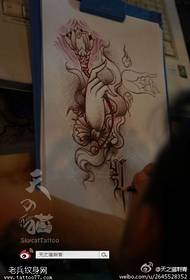 I-tattoo figure yacebisa umsebenzi we tattoo ye-buddha