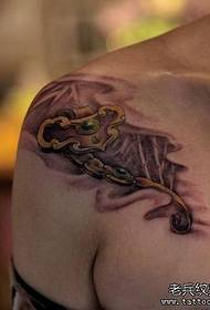 Girl's shoulders with a wishful tattoo pattern