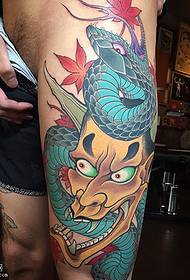 Thigh-painted snake-like tattoo pattern