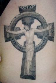Gesù tatuato sulla croce di pietra