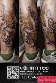 un fantastico tatuaggio classico della vagina con diamante di buddha sulla gamba