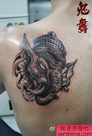 male shoulders a face of a fierce elephant tattoo pattern