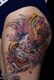 leg white snakelike tattoo pattern