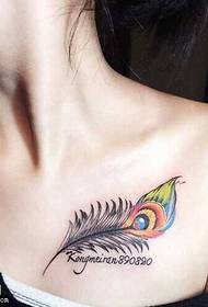 a small feather tattoo pattern of the collarbone