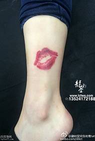 Red lips tattoo on the ankle