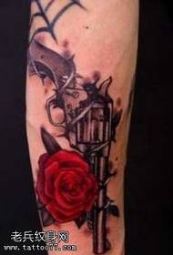 Leg color rose pistol tattoo pattern