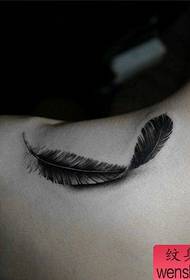 beautiful realistic feather tattoo pattern on the shoulder of the beautiful woman