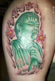 estatua verde de Buda con tatuaxe de flores