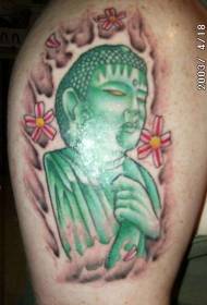 estatua de Buda verde con patrón de tatuaje de flor