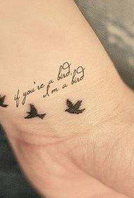 small fresh English words on the wrist and bird tattoo pictures
