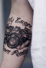 very personal Arm retro camera and English alphabet tattoo