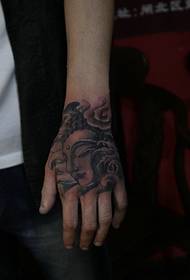 tangan kembali pola mini tato kepala Buddha