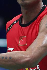 Lindan arm on five-pointed star with cross tattoo