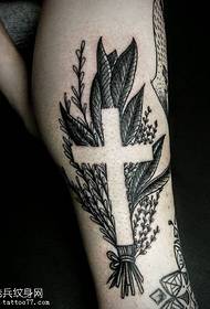 Cross tattoo pattern on calf