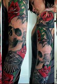 Iphethini ye-arm crow skull tattoo