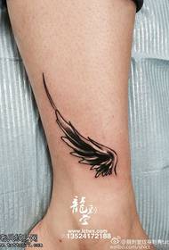 Classic wing tattoo on ankle