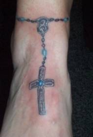 Modello tatuaggio croce caviglia caviglia