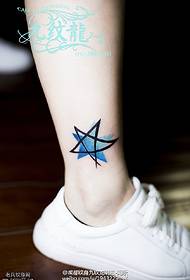 Watercolor five-pointed star tattoo on ankle