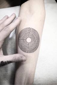 Schoolgirl arm on black line creative geometric element round tattoo picture