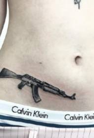 Enkel liten svart pistol tatuering bild