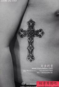 A cross-fare tattoo that is beautifully popular on the side waist
