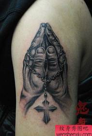 Male arm pop beautiful praying hand tattoo pattern