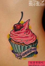 a colorful ice cream tattoo pattern on the waist of a girl