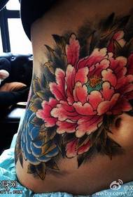 big peony tattoo pattern at the waist