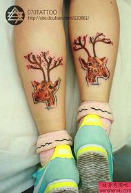 a popular beautiful giraffe tattoo pattern on the calf