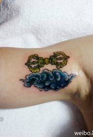 small diamond vampire and cloud tattoo pattern on the inside of the girl's arm
