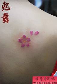 girl's back shoulder pop small cherry blossom tattoo pattern