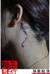girl ear small totem swallow tattoo pattern