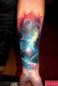 a beautiful starry tattoo on the arm